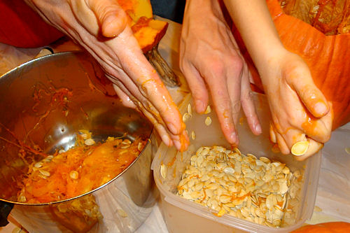 Carving Pumpkins 2010 - Teacher helps Sort Seeds