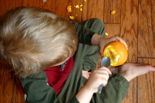 Using a Plastic Spoon to Peel an Orange