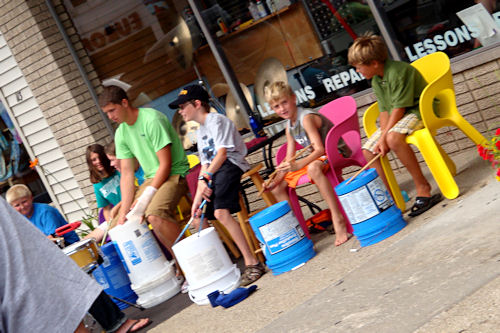 Kids Playing Drums on Buckets