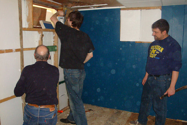 Egress Window - Three Men Working