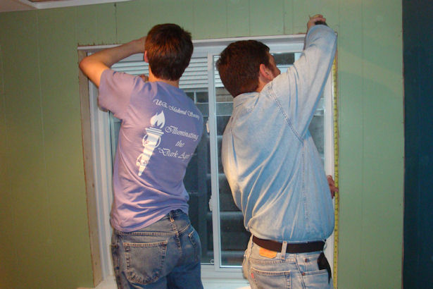 Egress Window - Father and Son Working