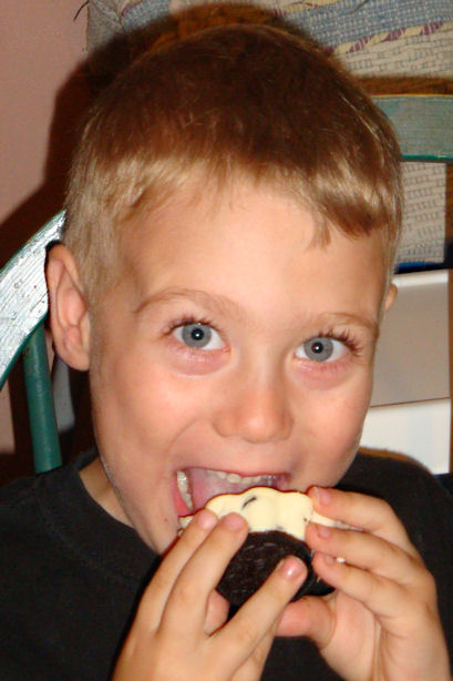 Oreo Cheesecake Cupcake Recipe - Little Guy Eating One